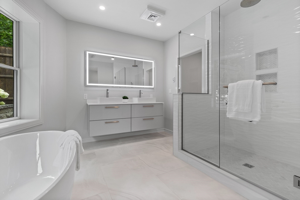 6 Claflin Road, Unit 2 Brookline, MA 02445 - Photo 19 of 39 a bathroom with a bathtub and a shower