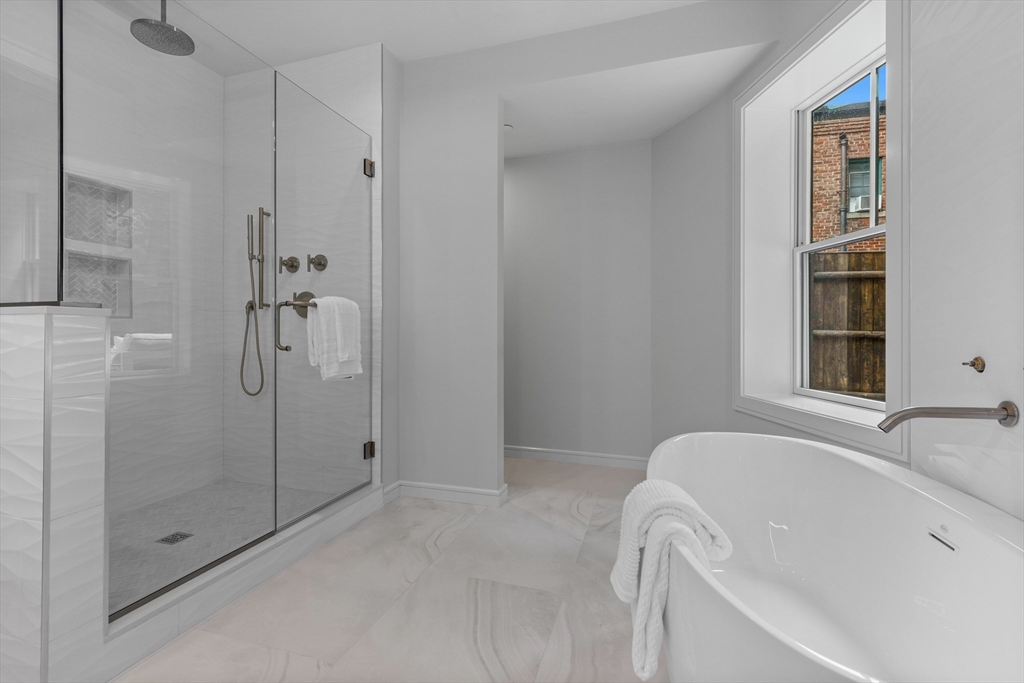 6 Claflin Road, Unit 2 Brookline, MA 02445 - Photo 20 of 39 a bathroom with a bathtub and shower