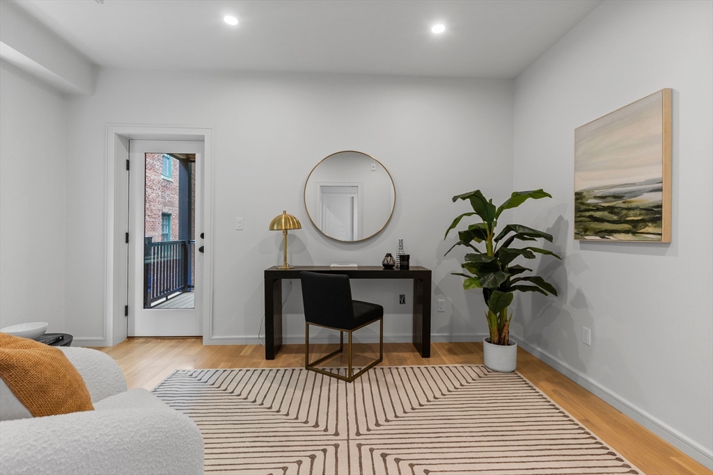 6 Claflin Road, Unit 2 Brookline, MA 02445 - Photo 25 of 39 a living room with furniture and a potted plant