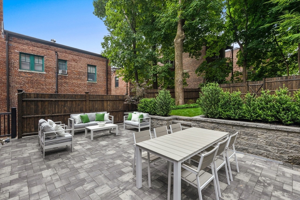 6 Claflin Road, Unit 2 Brookline, MA 02445 - Photo 33 of 39 a view of backyard of house with seating area