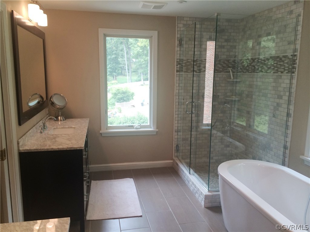 8908 Tolman Road Henrico, VA 23229 - Photo 23 of 30 Beautifully tiled shower and separate soaking tub