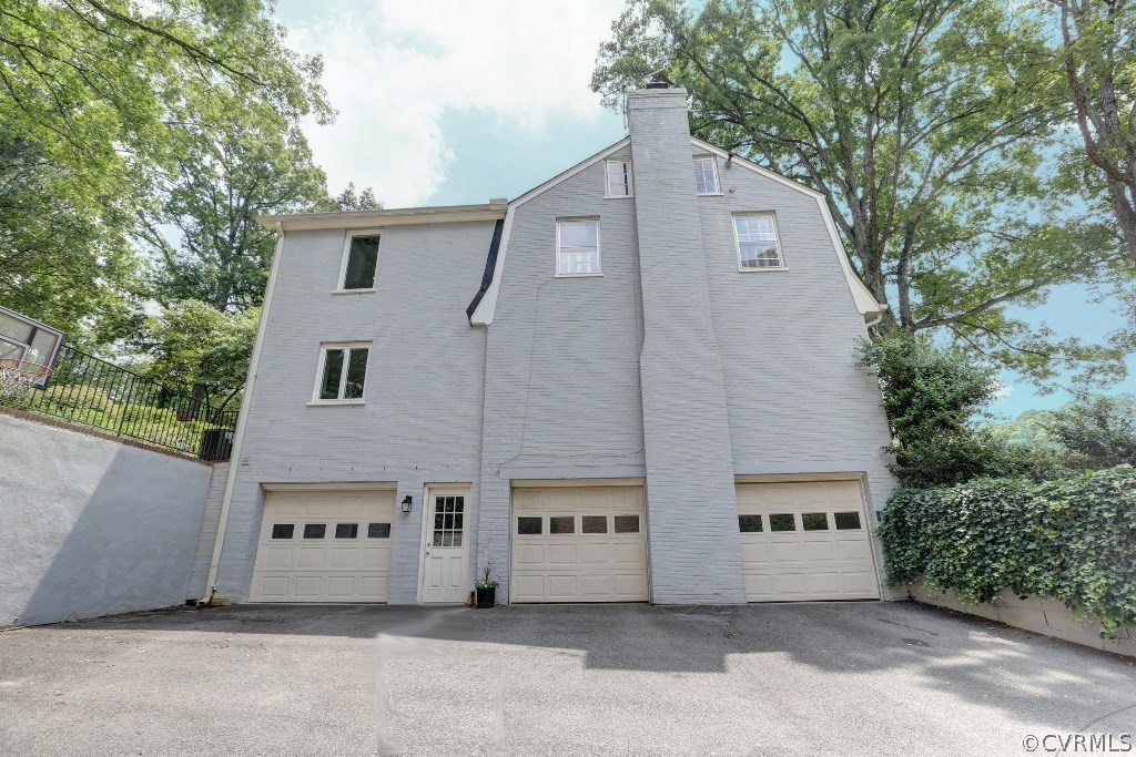 8908 Tolman Road Henrico, VA 23229 - Photo 6 of 30 Three car garage is a rare find in Mooreland Farms