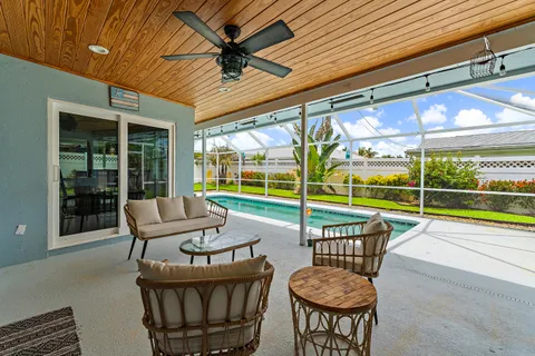 a view of a patio with a table and chairs