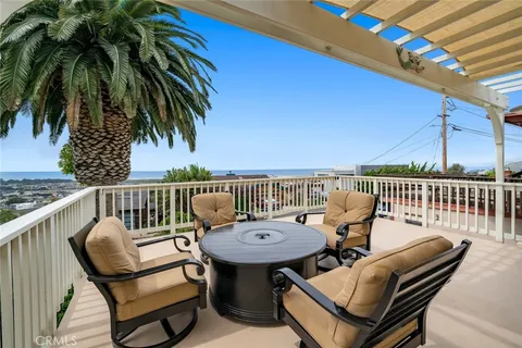 a balcony with wooden floor and outdoor space