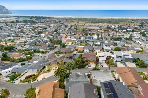 an aerial view of residential building and lake