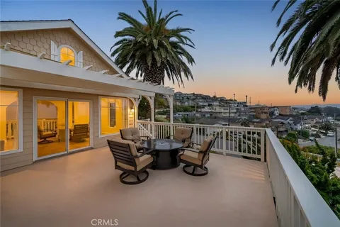 a view of swimming pool with outdoor seating