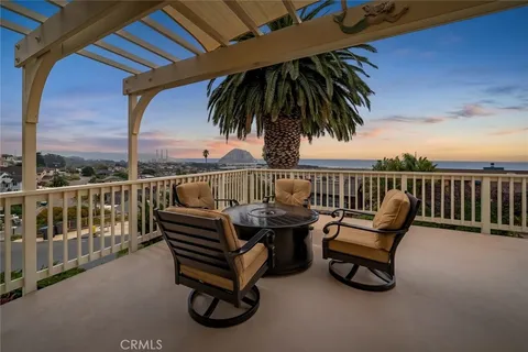 a roof deck with a couple of benches