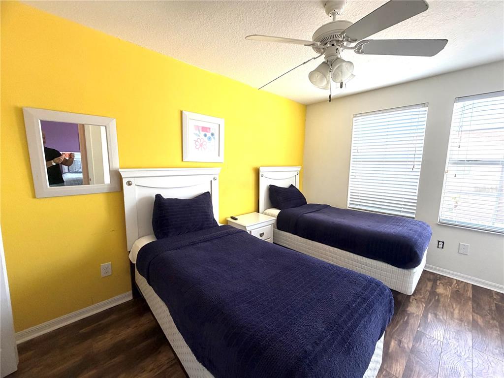 4573 Ada Lane Kissimmee, FL 34746 - Photo 13 of 37 a bedroom with two beds and a window