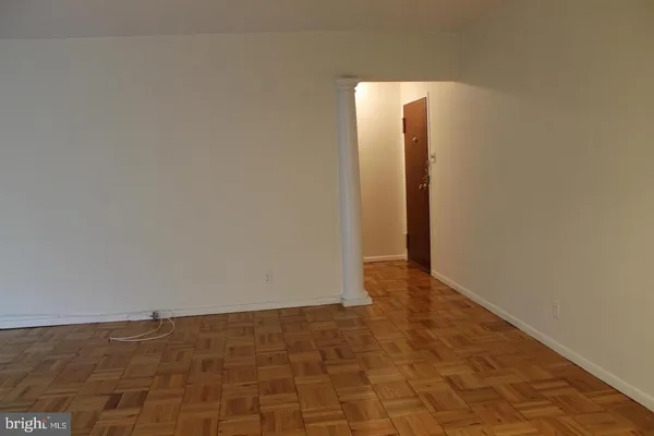 a living room with furniture and a piano