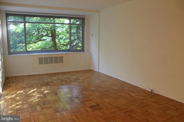 a view of a room with a large window