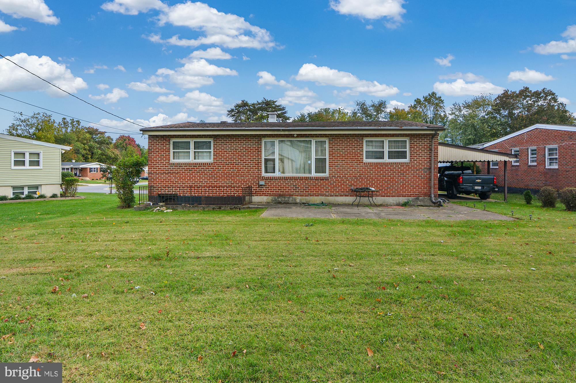 3312 Lauri Road Baltimore, MD 21244 - Photo 5 of 5 a view of a yard in front of a house with large tree