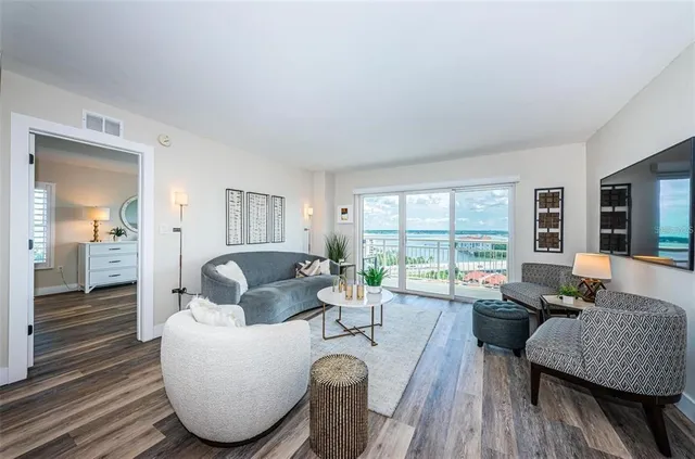 a living room with furniture and a large window