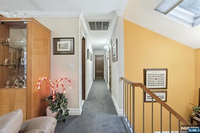 a view of a livingroom with furniture and stairs