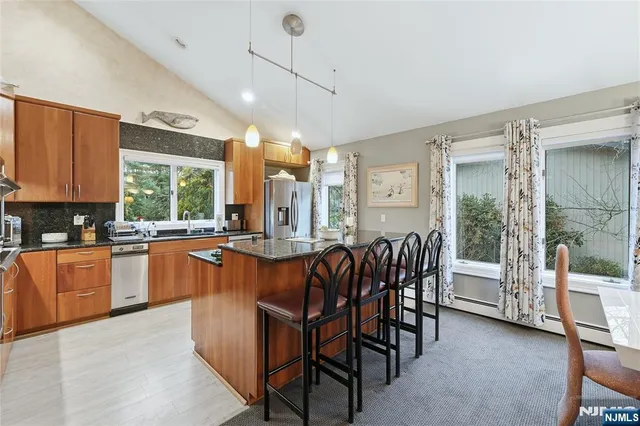 a large kitchen with a table and chairs