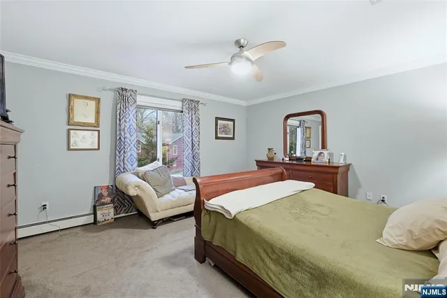 a bedroom with a bed gym equipment and a window