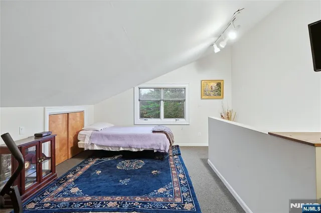 a bed room with a bed and a window