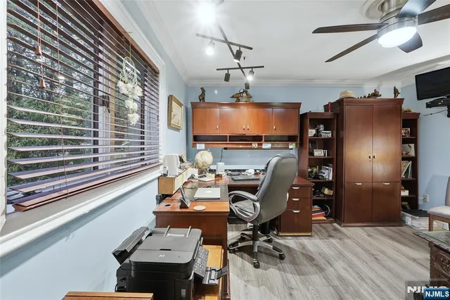 a room with furniture and a flat screen tv