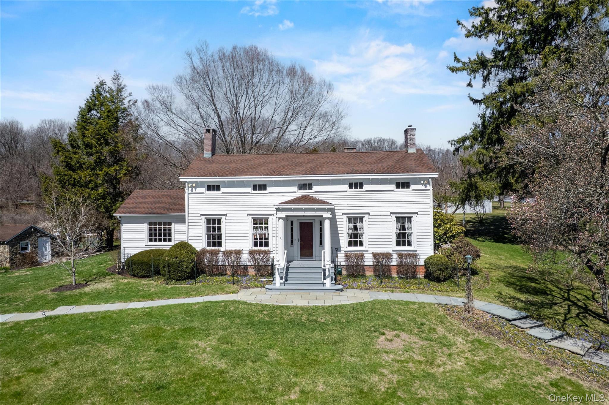 a view of a house with a backyard porch and sitting area