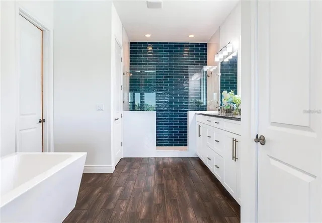 a bathroom with a bathtub and a sink