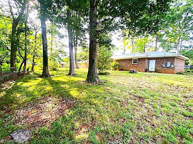 647 Hodgin Valley Road Pleasant Garden, NC 27313 - Photo 23 of 24 Acreage is shaded by mature trees.
