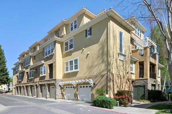 a front view of a building with lot of windows