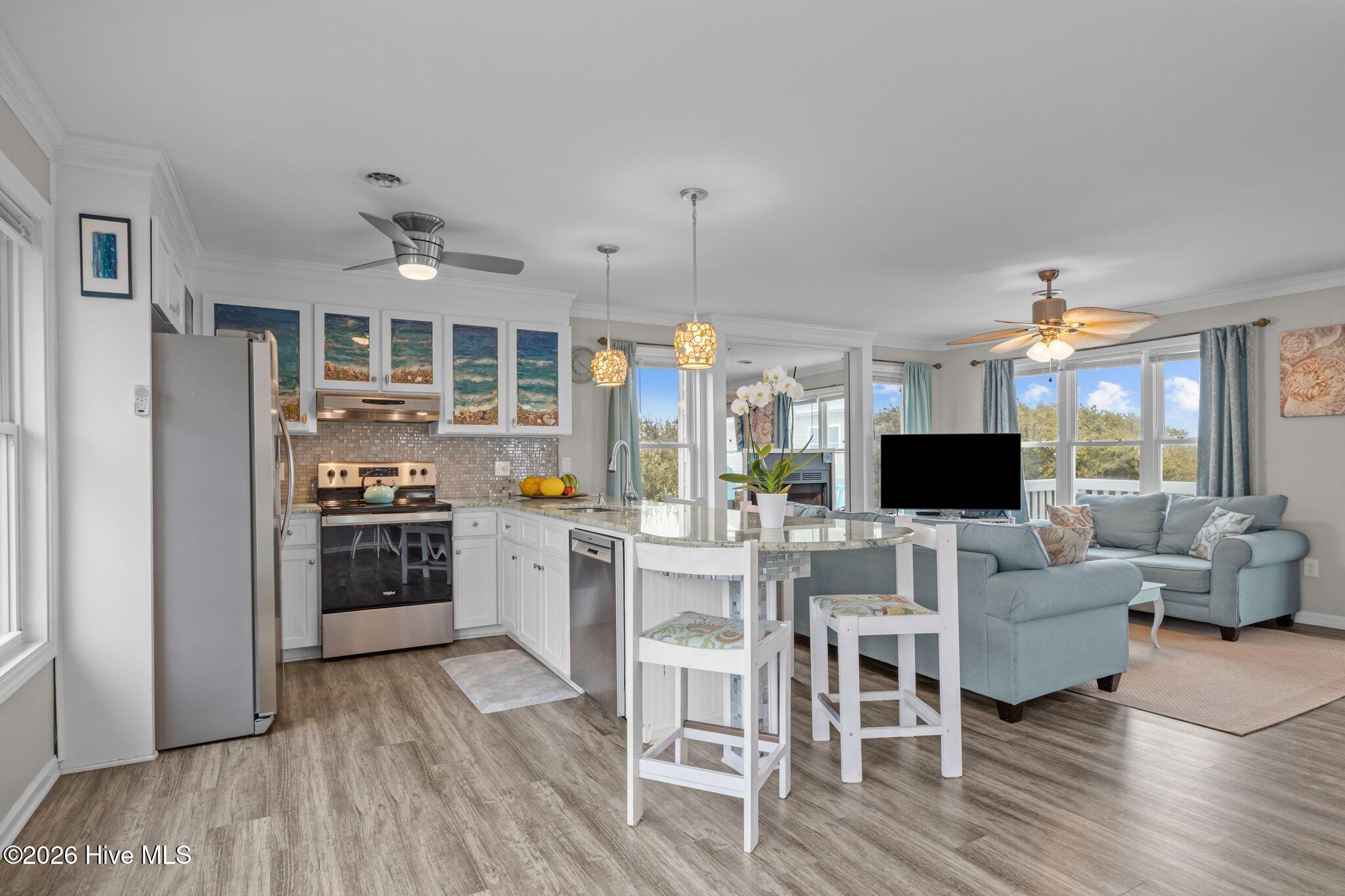 106 Azure Drive Emerald Isle, NC 28594 - Photo 19 of 71 Top level view into kitchen