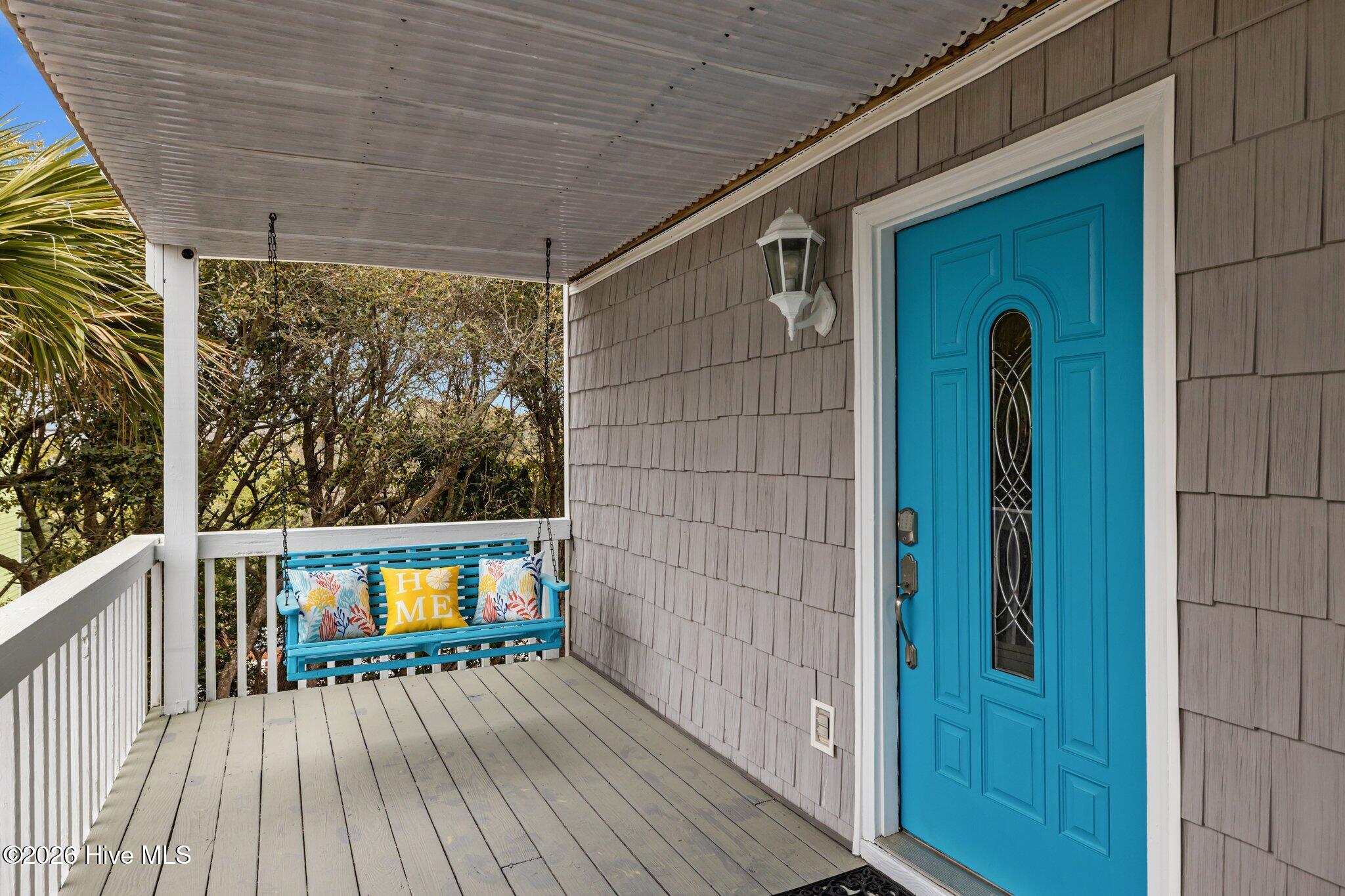 106 Azure Drive Emerald Isle, NC 28594 - Photo 40 of 71 Front entrance. Covered wrap around deck - perfect for a swing.
