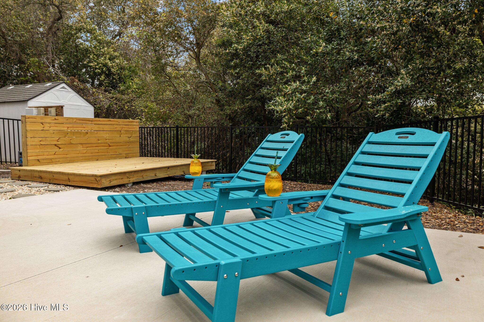 106 Azure Drive Emerald Isle, NC 28594 - Photo 42 of 71 Lounging area by pool