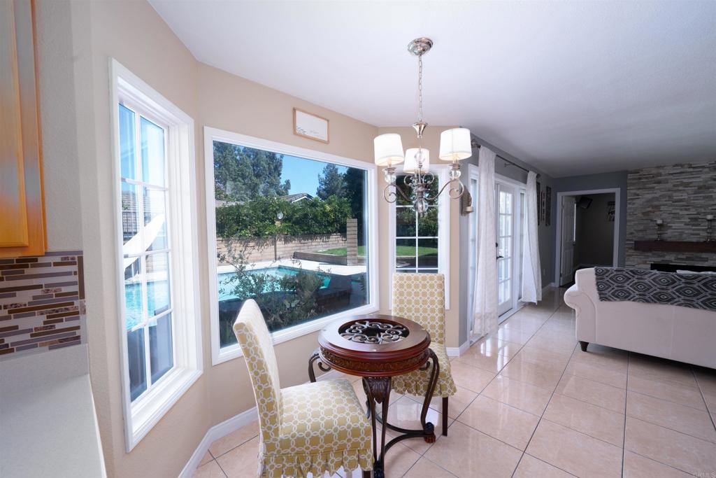 a view of a dining room and a furniture wooden floor a chandelier