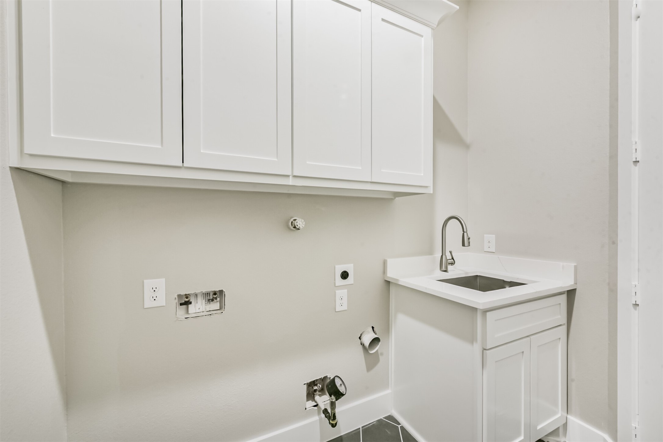2803 Lancaster Lane Pasadena, TX 77506 - Photo 37 of 45 a bathroom with a sink and cabinets