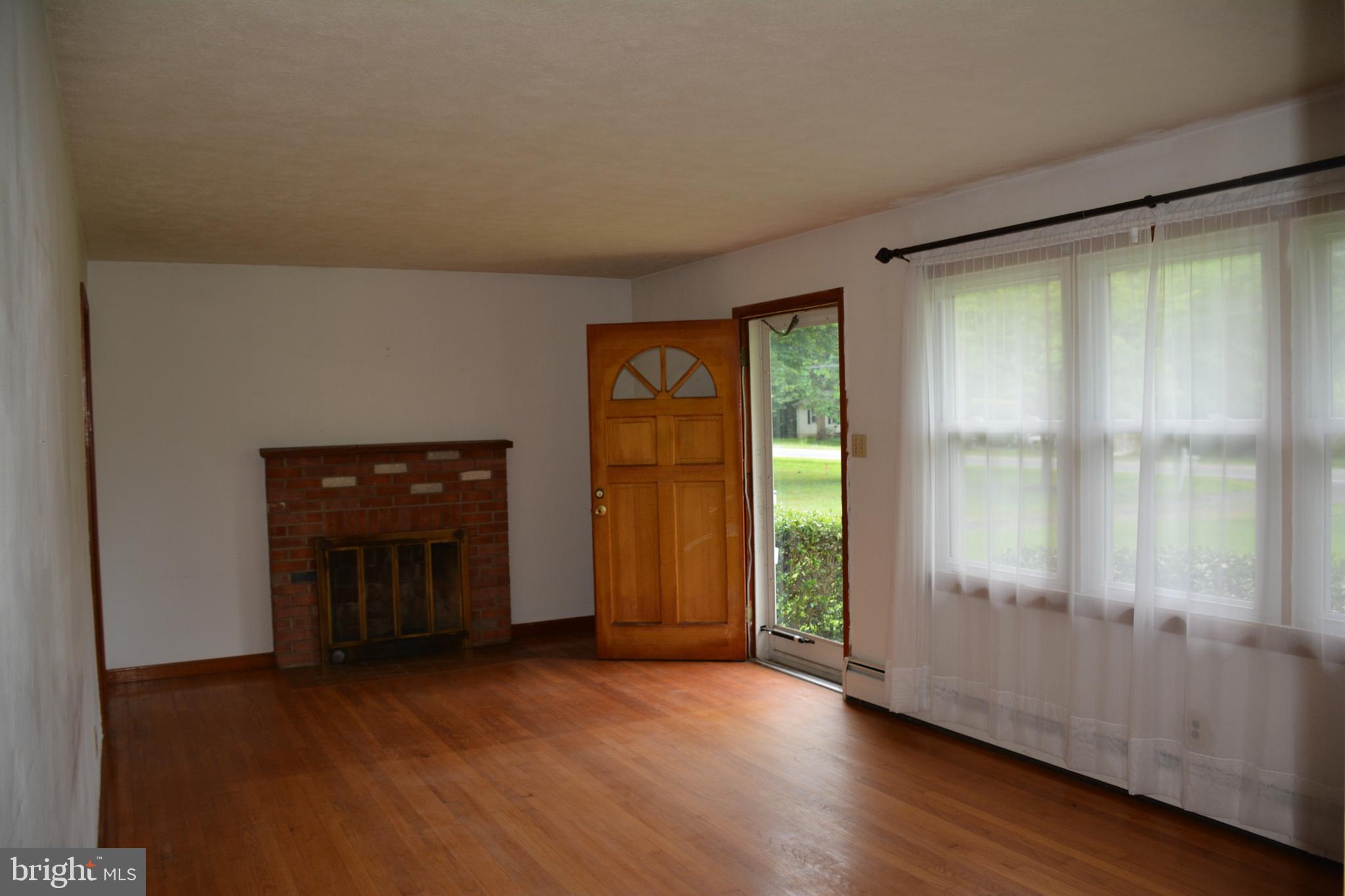 Living Room with Wood Burning Fireplace