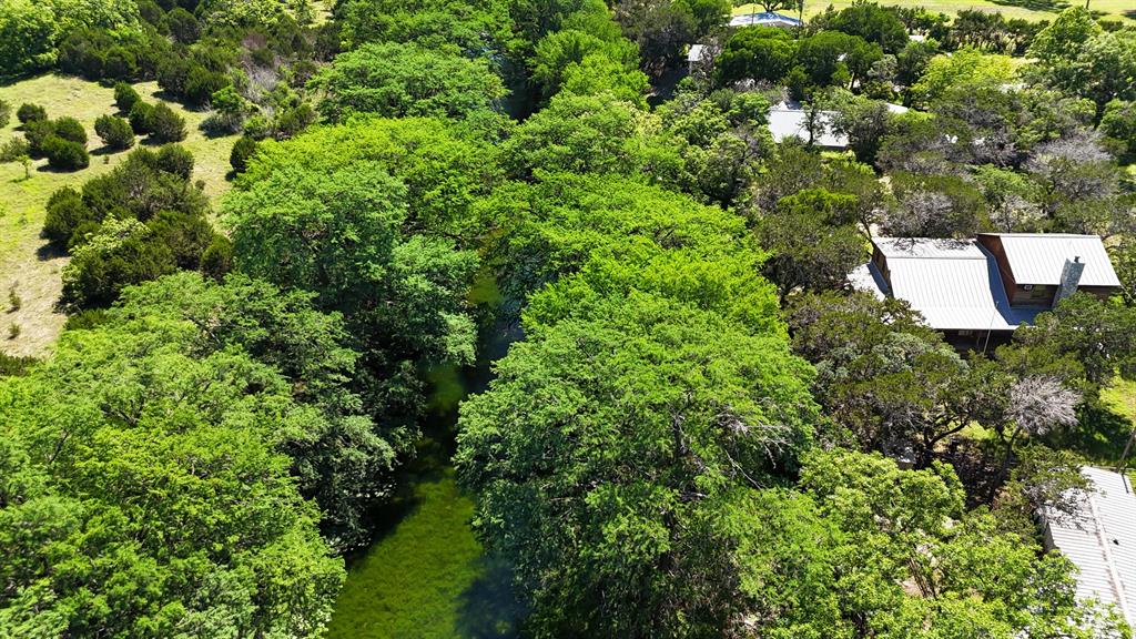187 Roy Chisum Road Leakey, TX 78873 - Photo 30 of 40 an aerial view of a house with a tree
