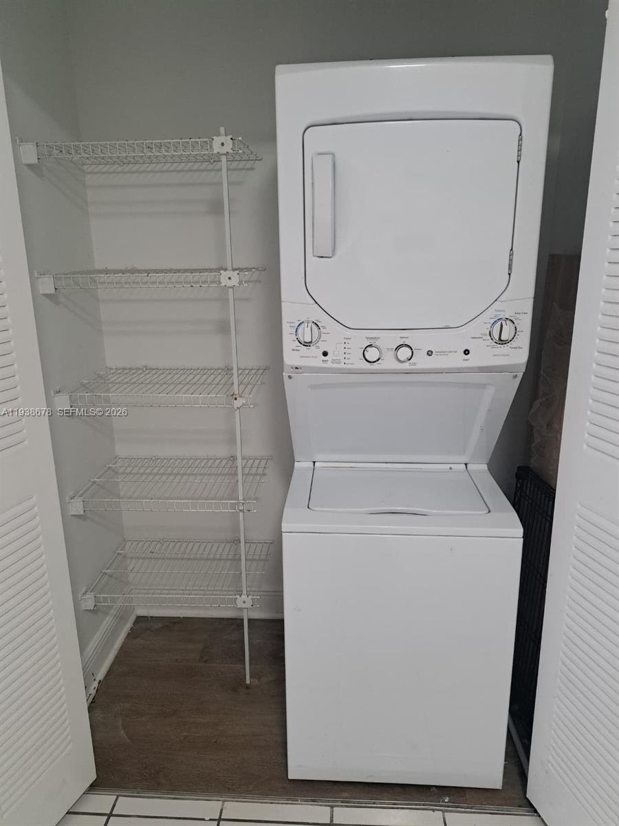 5091 Northwest 7th Street, Unit 1015 Miami, FL 33126 - Photo 11 of 30 a close up view of a washer and dryer