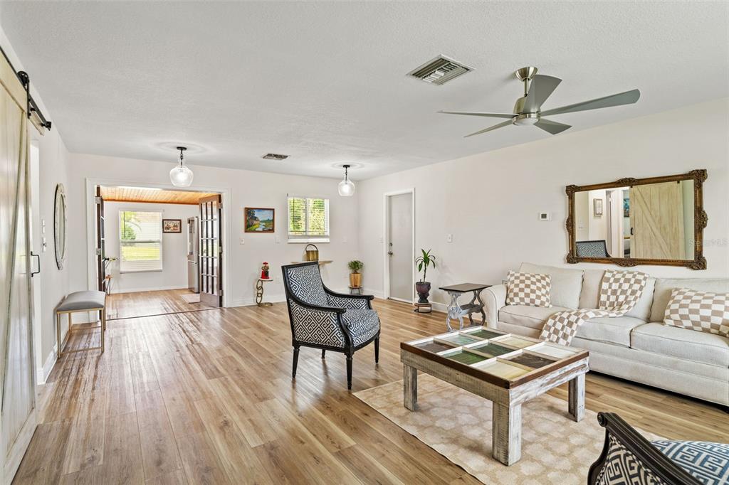 11487 Linden Drive Spring Hill, FL 34608 - Photo 11 of 42 a living room with furniture and a wooden floor