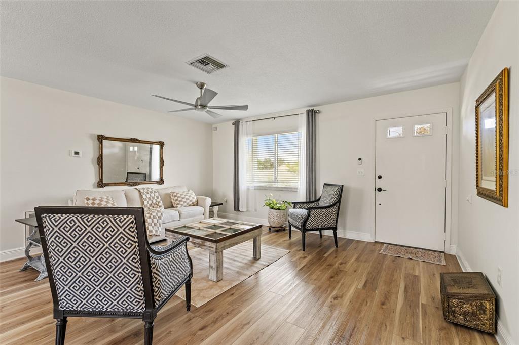 11487 Linden Drive Spring Hill, FL 34608 - Photo 12 of 42 a living room with furniture and wooden floor