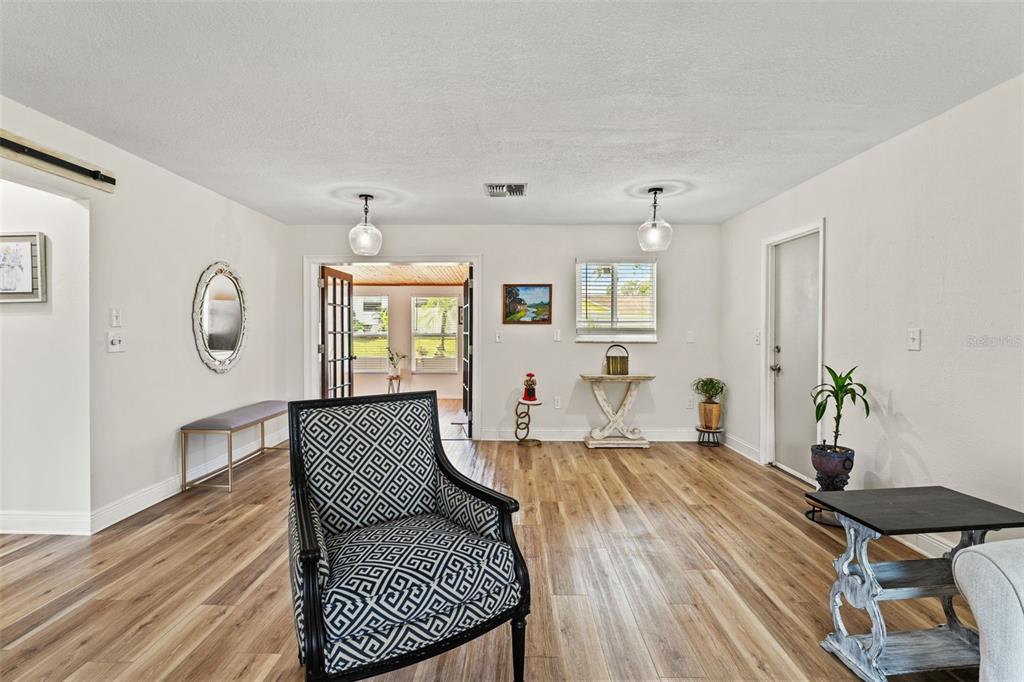11487 Linden Drive Spring Hill, FL 34608 - Photo 13 of 42 a living room with furniture and wooden floor