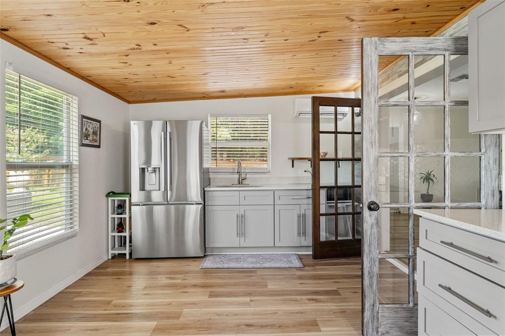 11487 Linden Drive Spring Hill, FL 34608 - Photo 16 of 42 a view of wooden floor and windows in a room