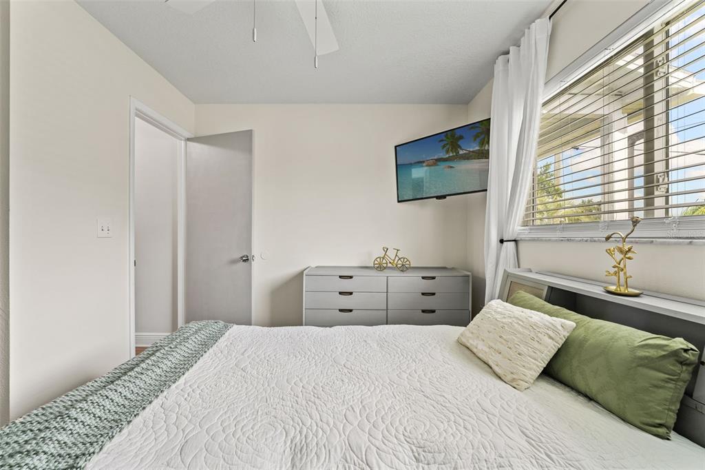 11487 Linden Drive Spring Hill, FL 34608 - Photo 19 of 42 a bedroom with a large bed and a window