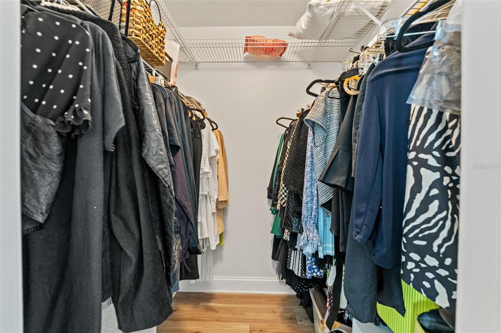 11487 Linden Drive Spring Hill, FL 34608 - Photo 20 of 42 a view of walk in closet with clothes and shoes