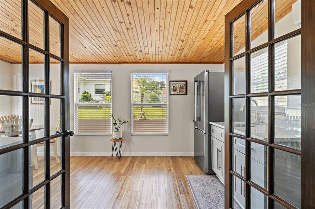 11487 Linden Drive Spring Hill, FL 34608 - Photo 2 of 42 a view of empty room with wooden floor and fan