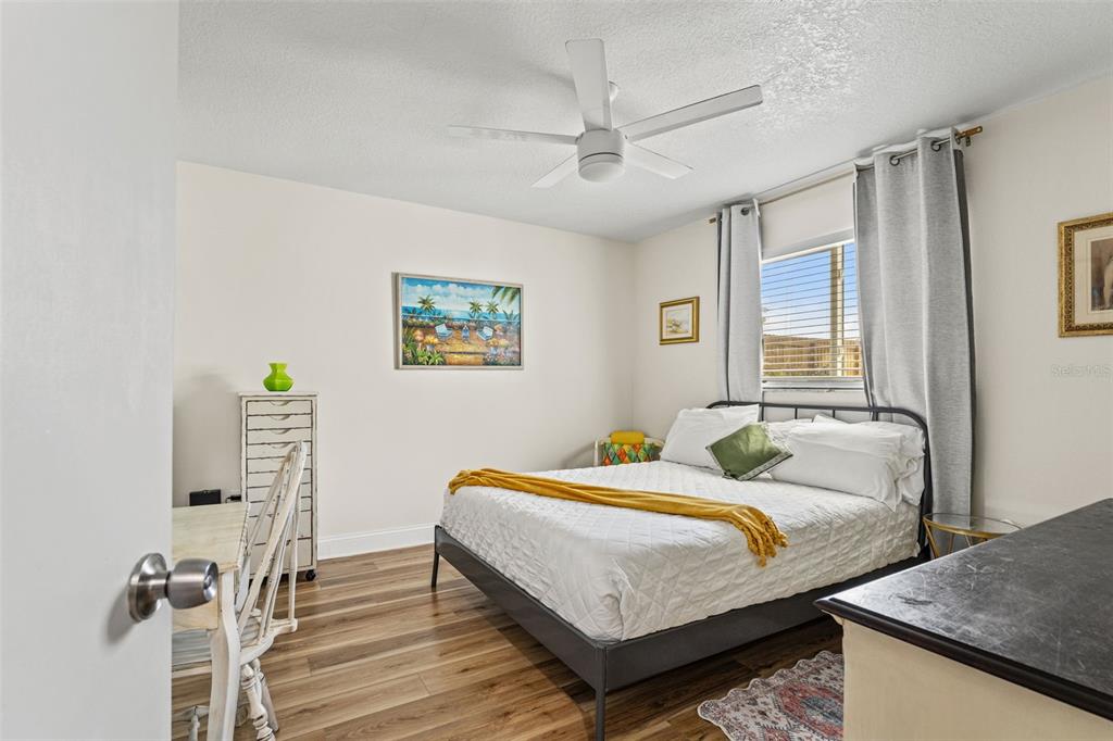 11487 Linden Drive Spring Hill, FL 34608 - Photo 21 of 42 a bedroom with a bed and a dresser next to a window