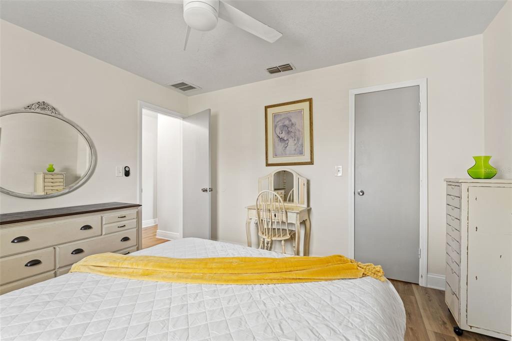 11487 Linden Drive Spring Hill, FL 34608 - Photo 22 of 42 a bedroom with a bed and a dresser in it