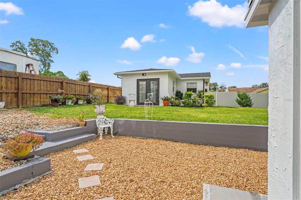 11487 Linden Drive Spring Hill, FL 34608 - Photo 24 of 42 a view of backyard with a garden and plants