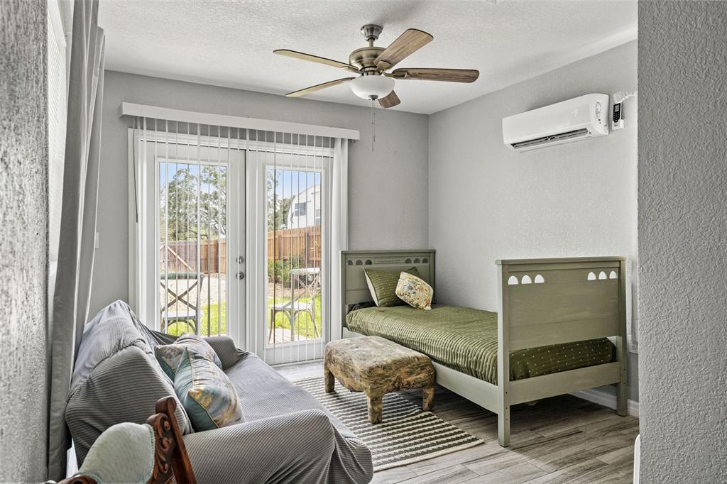 11487 Linden Drive Spring Hill, FL 34608 - Photo 30 of 42 a bedroom with furniture and a large window