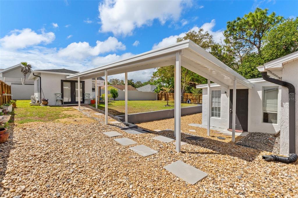 11487 Linden Drive Spring Hill, FL 34608 - Photo 37 of 42 a view of a house with a large window and a yard