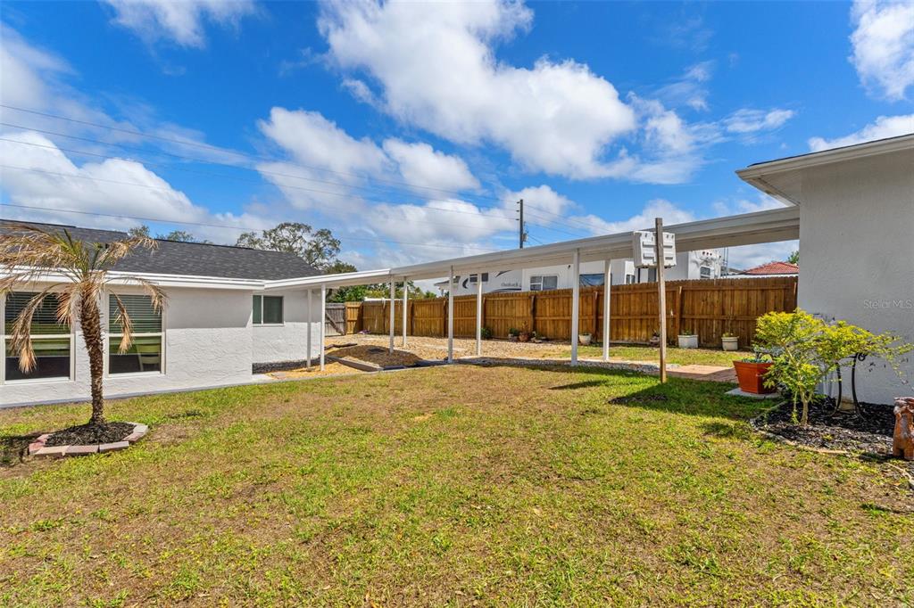 11487 Linden Drive Spring Hill, FL 34608 - Photo 39 of 42 a view of a house with swimming pool and sitting area