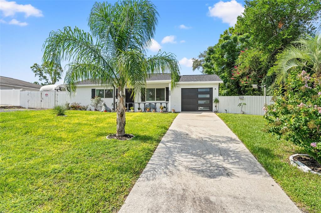 11487 Linden Drive Spring Hill, FL 34608 - Photo 6 of 42 a front view of house with yard and green space