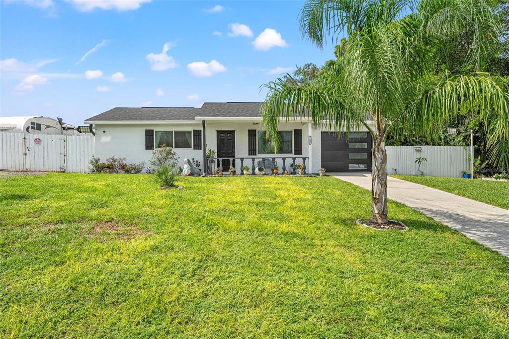 11487 Linden Drive Spring Hill, FL 34608 - Photo 7 of 42 a swimming pool with outdoor seating and yard
