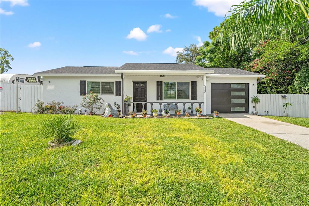 11487 Linden Drive Spring Hill, FL 34608 - Photo 8 of 42 a front view of house with yard and outdoor seating