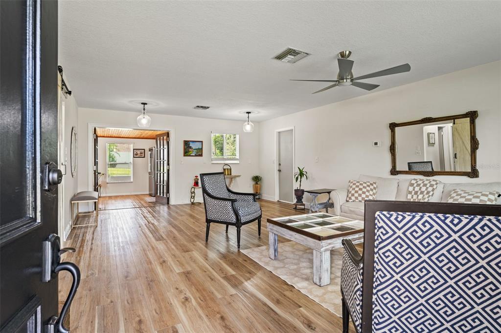 11487 Linden Drive Spring Hill, FL 34608 - Photo 10 of 42 a living room with furniture and a wooden floor